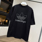 Balenciaga | Adidas Oversized T-Shirt (Black/Embroidered)