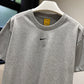 Nike NOCTA Tee (Heather Gray)